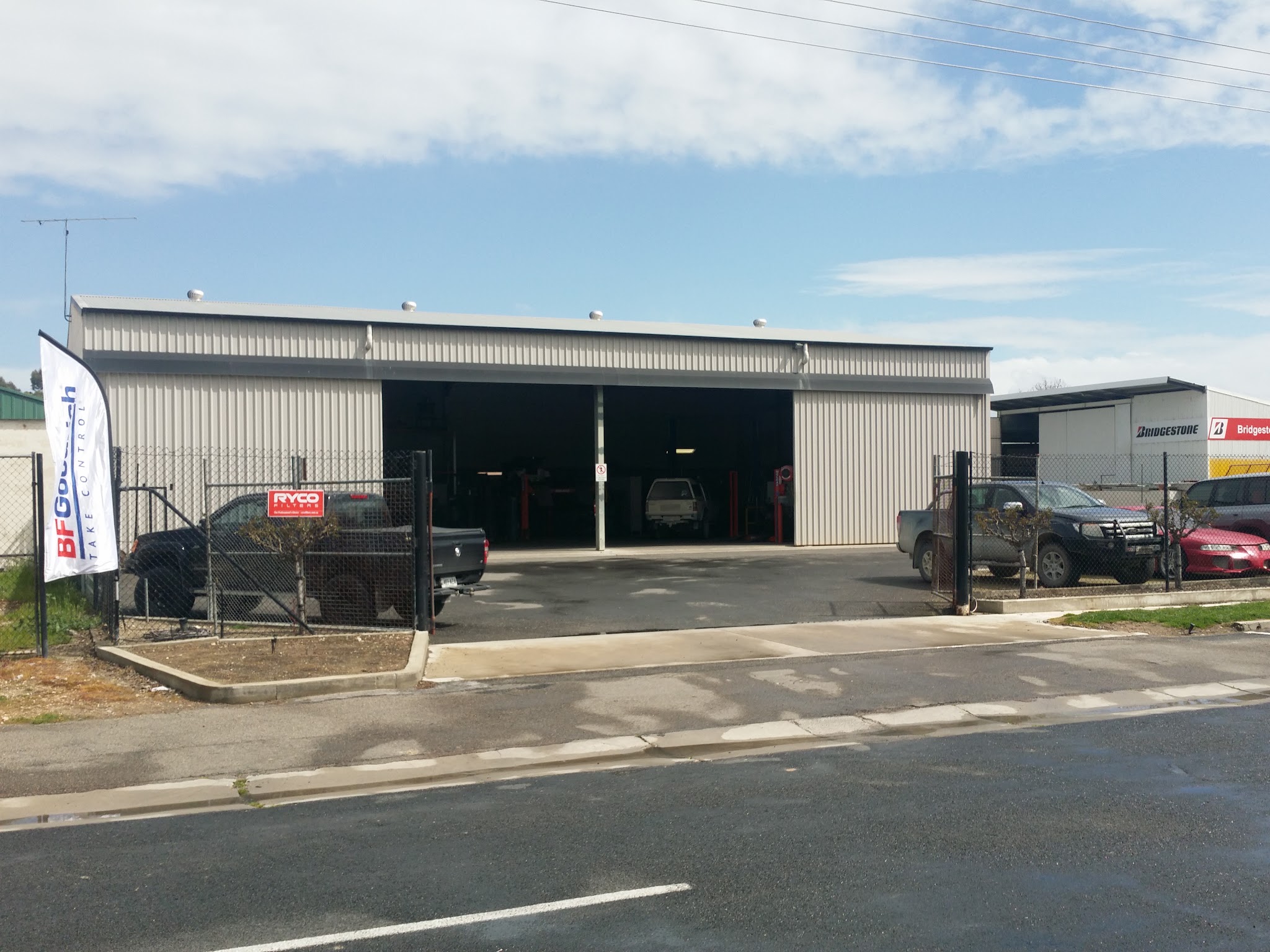 The front of the Matson Motors workshop seen from McBain Street, with the roller doors open