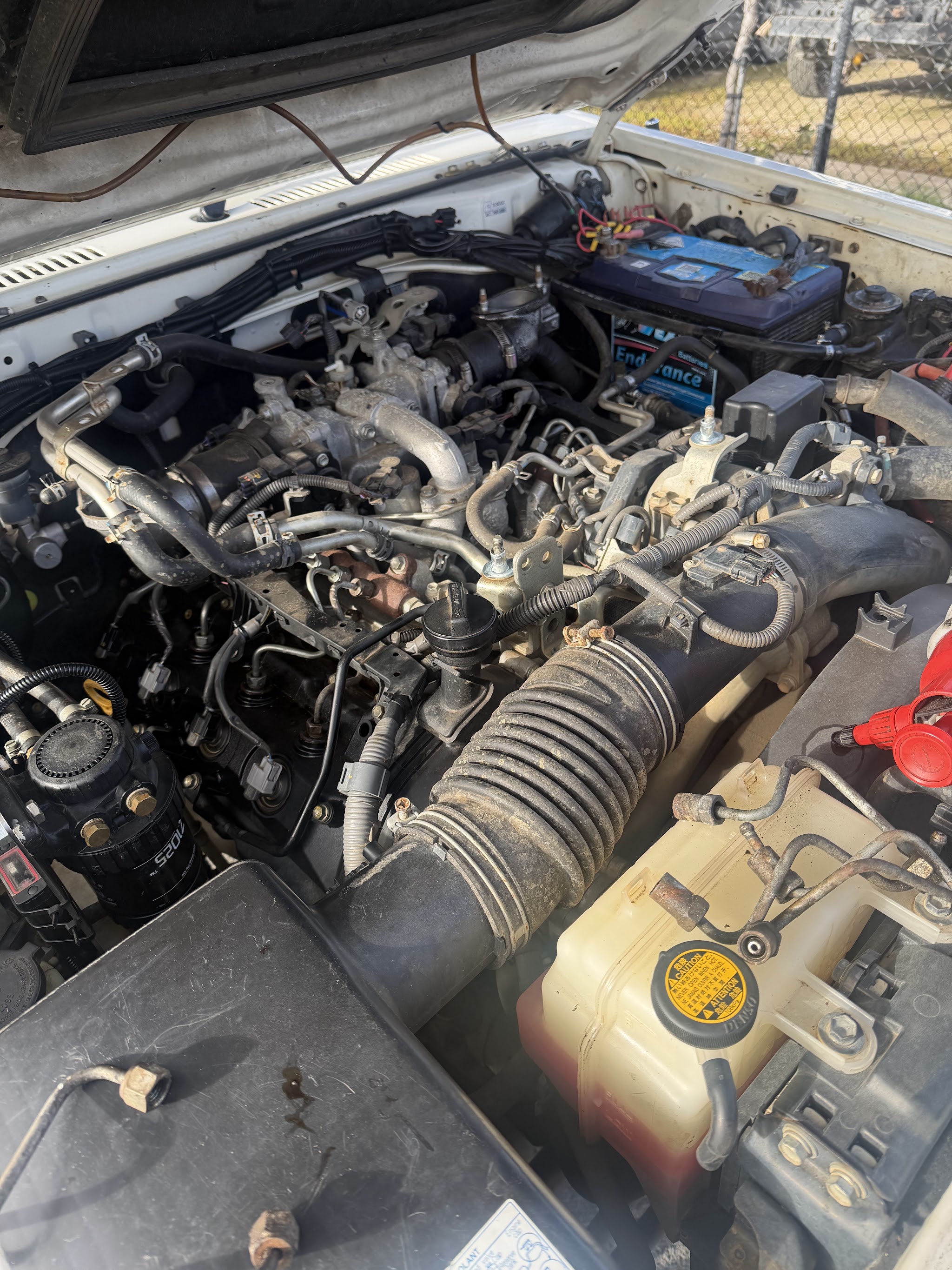 An open engine bay part way through a repair at Matson Motors